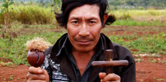 Frank Weaver, Guarani shaman holding cross and rattle, 2006