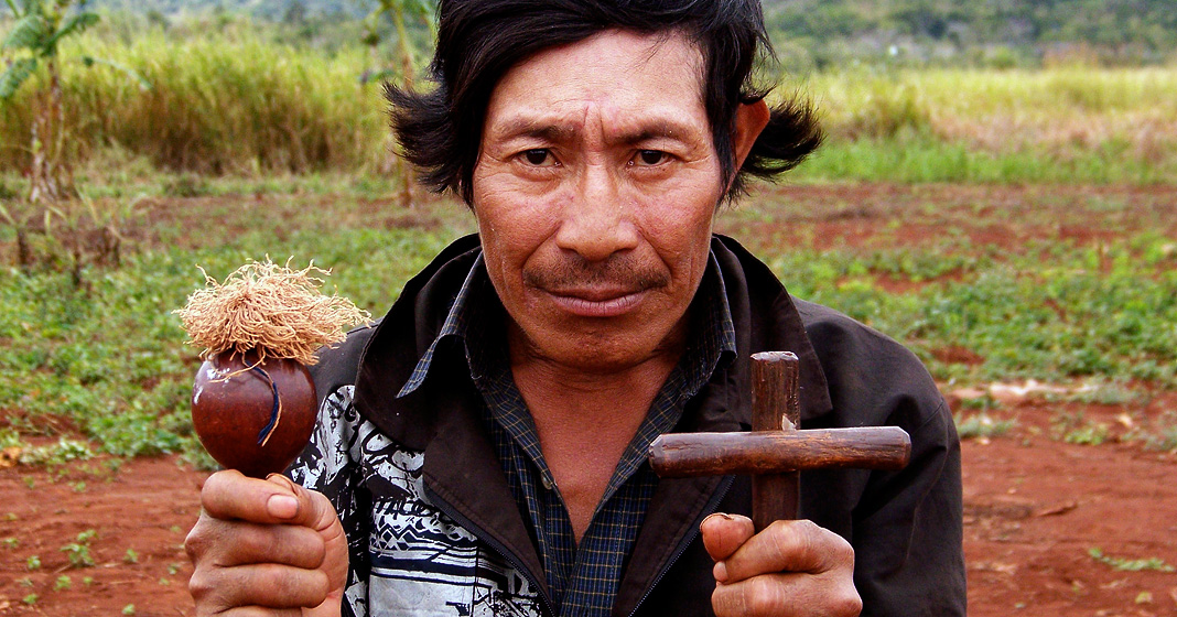 Frank Weaver, Guarani shaman holding cross and rattle, 2006